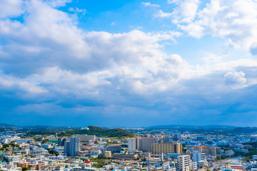 Fototapeta na wymiar 沖縄 青空の都市風景