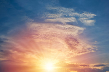 Beautiful sunset sky and clouds with dramatic light, Twilight sky and sun rays, Orange and red sky background with light of the sun-Image