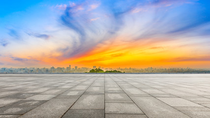 Wide square floor and city skyline at sunrise in Hangzhou,China.
