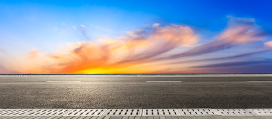 Empty asphalt road and beautiful colorful clouds landscape at sunset,panoramic view.