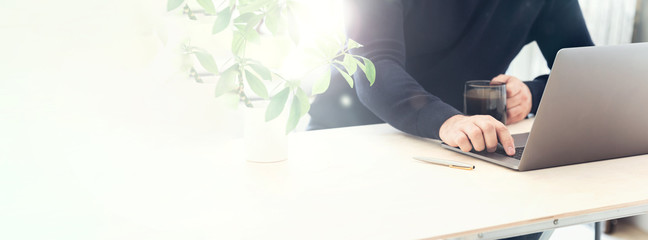 Online training concept. Professional blogger looking at computer. Copy space