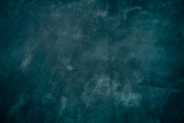 Texture and background of dark raw concrete wall.
