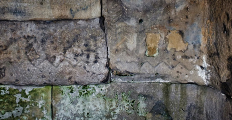 texture of an old stone wall with ancient images