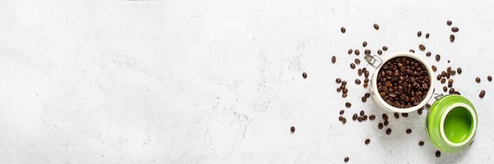 can with coffee and coffee beans scattered on a concrete background. Banner. Concept of fresh coffee, breakfast, plantation. Top view, flat lay