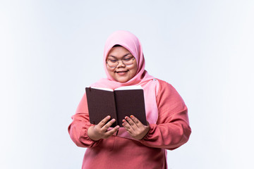 young attractive asian woman who reads a book