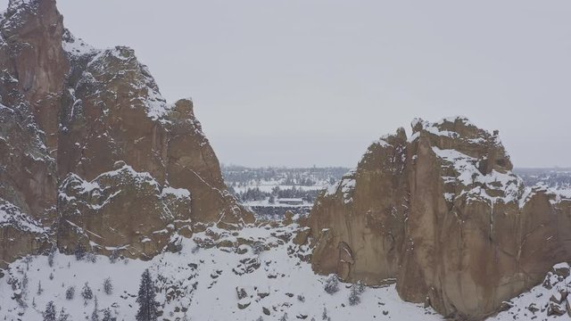 Oregon Aerial v43 Flying through park backwards looking west at cliffside home, passing by asterix, looking at east face park skyline - March 2019