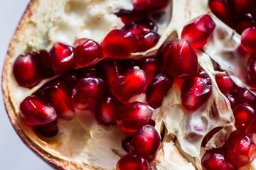 macro photography of pomegranate fruits with red juicy grains