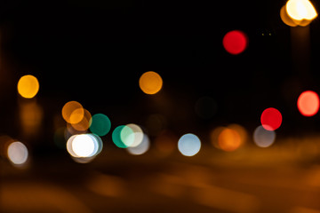 Blurred city lights of an intersection at night