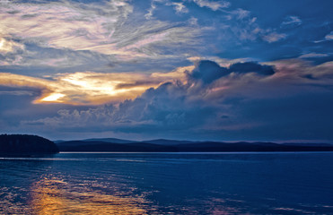 forest lake at sunset with beautiful clouds