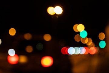 Blurred city lights of an intersection at night