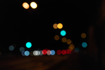 Blurred city lights of an intersection at night