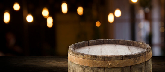 Wooden barrel on a table and textured background