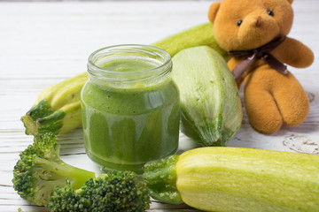 baby puree with fresh zucchini and broccoli ingredients in a jar. baby food.