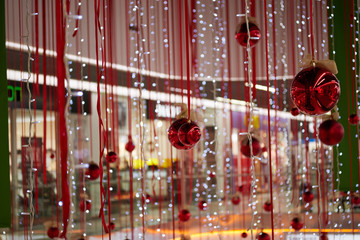 Christmas red balls with summer and garlands is decoratively decorated to decorate the market