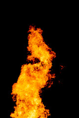 Yellow red and orange fire flames blazing fiery burning isolated on a black background