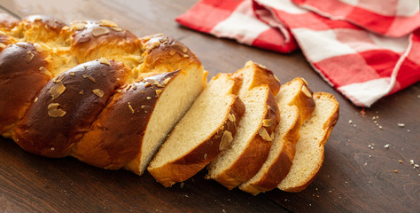 Easter greek tsoureki braid, sweet bread brioche on wood
