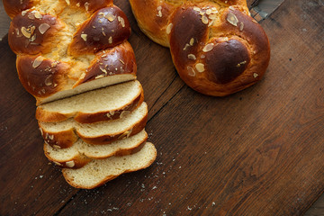 Easter greek tsoureki braid, sweet bread brioche on wood