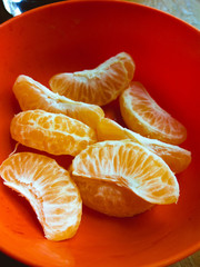 Very fresh healthy orange slices in bowl