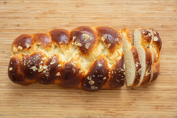 Easter greek tsoureki braid, sweet bread brioche on wood