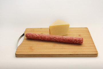 piece of cheese on wooden board