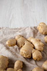 Raw Organic Ginger Root on cloth, low angle view. Copy space.