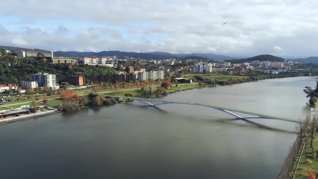 View of the Ponte Pedonal Pedro e In&ecirc;s over the Mondego River, Coimbra, Portugal