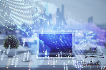 Forex Chart hologram on table with computer background. Multi exposure. Concept of financial markets.