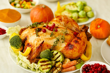 Tasty baked turkey for Thanksgiving day on table