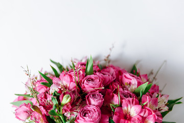 Flower bouquet of pink roses and other mixed flowers. Copy space