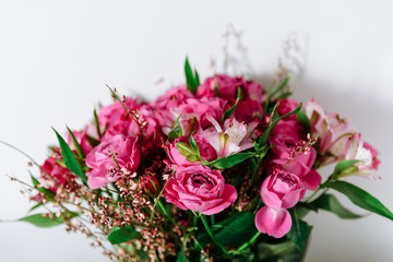 Flower bouquet of pink roses and other mixed flowers