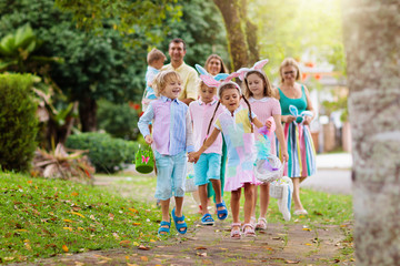 Family with kids on Easter egg hunt