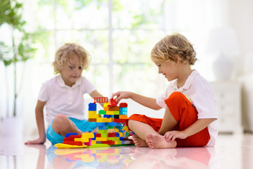 Obraz na płótnie Canvas Child playing with toy blocks. Kids play.