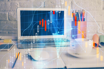 Financial market graph hologram and personal computer on background. Multi exposure. Concept of forex.