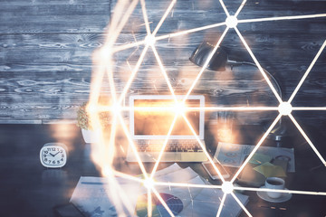 Computer on desktop with social network hologram. Multi exposure. Concept of international people...