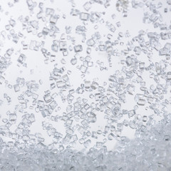 Close up of crystal sugar in Glass bottles on white background.