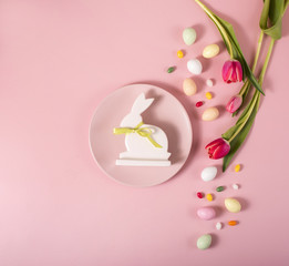 Obraz na płótnie Canvas Easter layout with easter bunny, tulips, eggs