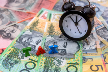 'Tax Time' concept with australian dollars and clock on it close up