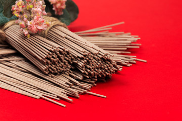 Dried Organic Buckwheat Soba Noodles Ready to Cook on red background  - Image