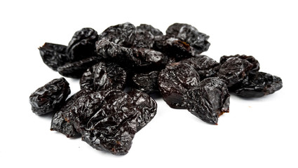 Dried plums on white background