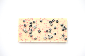 White chocolate bars with dried blueberries and strawberries.