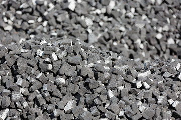 A scattering of gray slag on a sunny day.