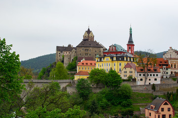 Fototapeta na wymiar Panorama of the picturesque small village of Loket, with the bridge, the Castle and the Church of St. Wenceslaus at the background (Czech Republic)