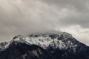 misty mountain gorgeous landscape view winter time snow cover and cloudy sky dramatic background space