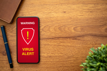 phone with warning virus alert alarm on the screen