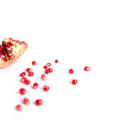 Fresh whole and half of pomegranate isolated on white background