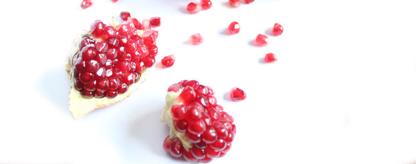 Banner. Ripe juicy Garnet fruit, pomegranate, isolated on white.