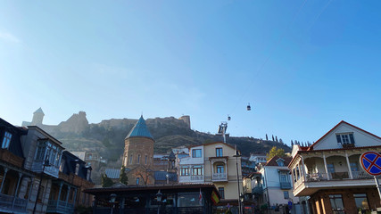 Fototapeta na wymiar TBILISI, GEORGIA DECEMBER 14, 2019: Old Tbilisi architecture, Narikala fortress in e distend in Tbilisi, Georgia