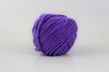 Violet yarn closeup isolated on white background