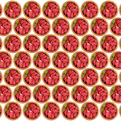 Raw meat is cut into pieces in a wooden plate. Isolated on white background. 