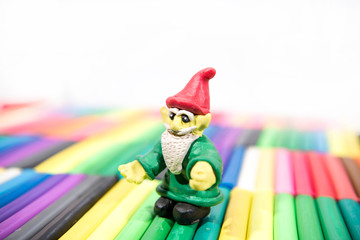 Play clay Animals. Gnome on colored background.